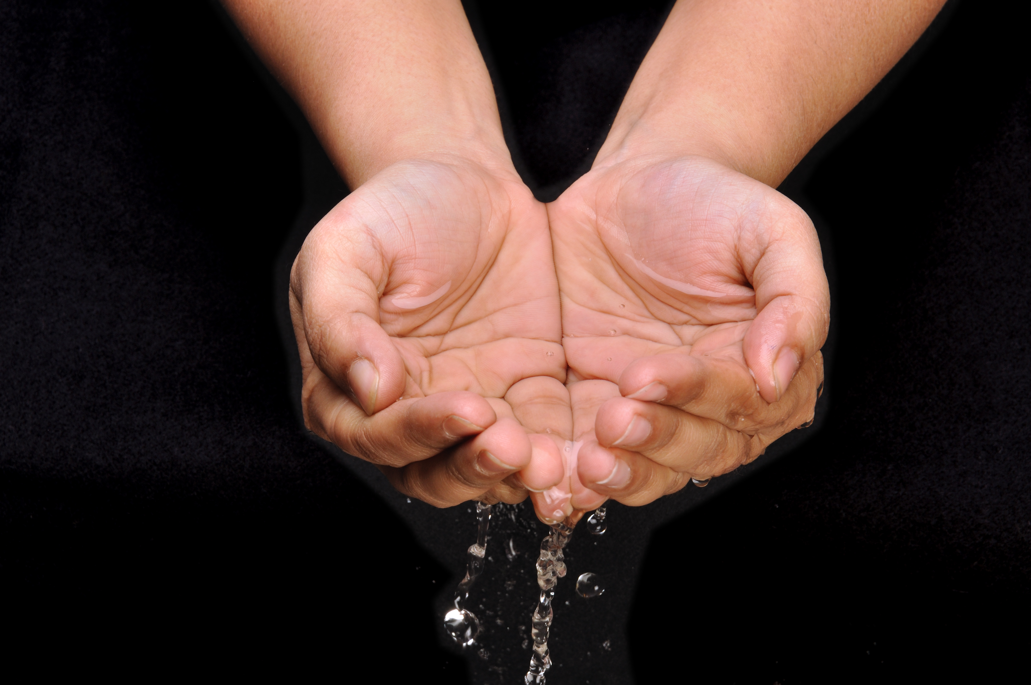 Cupped hands. Hand holding Water. Handful. Prayer hands. Water person hand.
